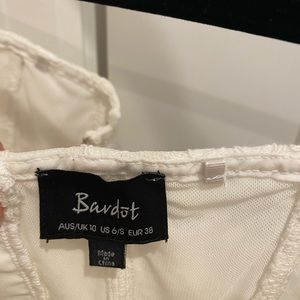 White lace body suit from Revel